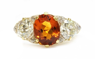 A late Victorian citrine and diamond boat shaped carved head ring