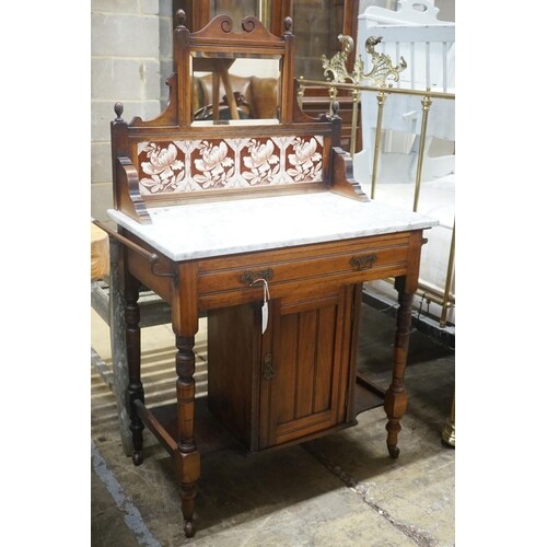 A late Victorian marble-topped mahogany wash stand, width 80...