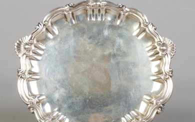 A late Victorian silver pin tray, with scrolled and shell de...