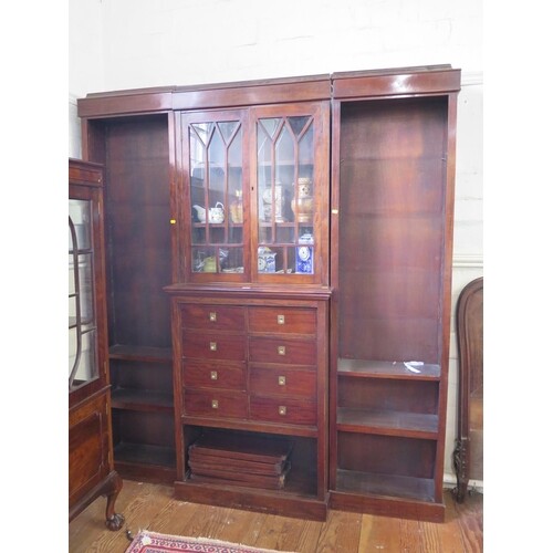 A mahogany breakfront bookcase cabinet, the moulded cornice ...