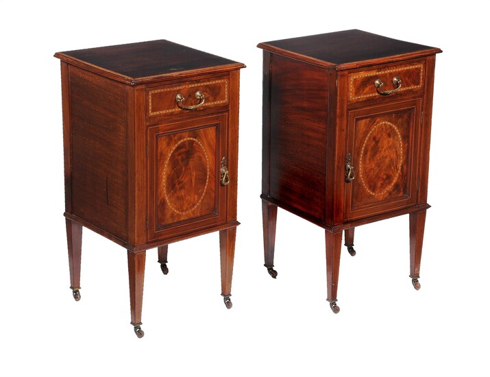 A pair of Edwardian mahogany bedside cupboards