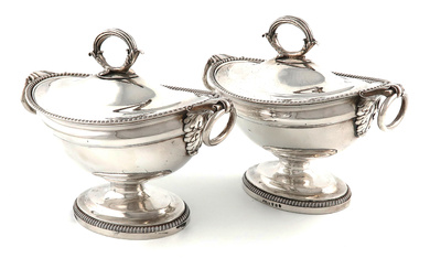A pair of George III silver sauce tureens and...
