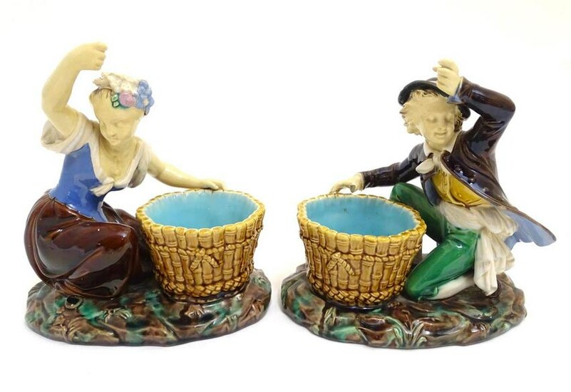 A pair of Minton style majolica figures after designs