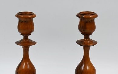 A pair of candlesticks made of olive wood, engraved...