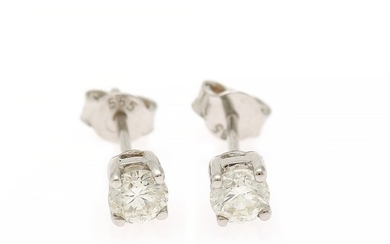 A pair of diamond solitaire ear studs each set with a brilliant-cut diamond totalling app. 0.60 ct., mounted in 14k white gold. (2)