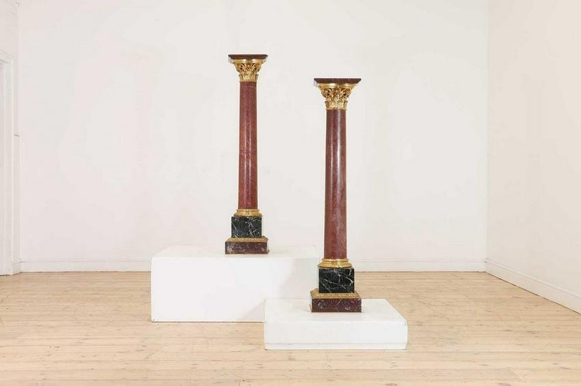 A pair of rouge marble pedestals