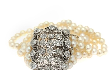 NOT SOLD. A pearl and diamond bracelet set with numerous cultured freshwater pearls and old-cut...