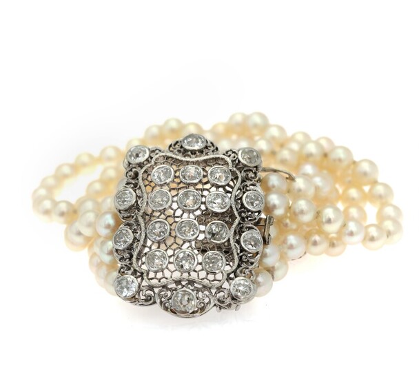 NOT SOLD. A pearl and diamond bracelet set with numerous cultured freshwater pearls and old-cut...
