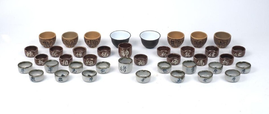 A quantity of saki cups, of modern manufacture, ceramic, in varying sizes and glaze finishes, hand-decorated, 4.8-7.5cm diameter