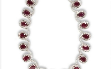 A ruby, diamond and eighteen karat white gold necklace