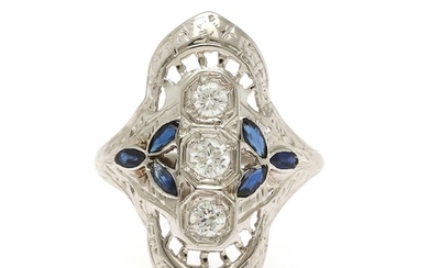 A sapphire and diamond ring set with six marquise-cut sapphires and three brilliant-cut diamonds, mounted in 18k white gold. Size 49.