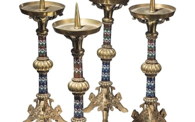 A set of four French gilt and enamelled pricket candlesticks in romanesque style, late 19th century