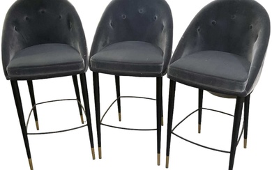 A set of three modern contemporary button back upholstered bar...