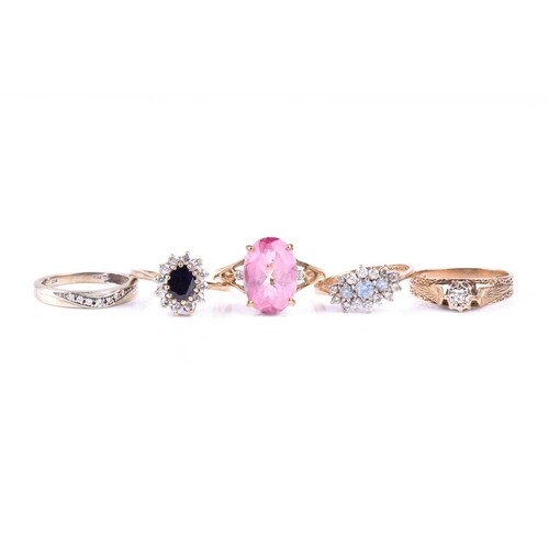 § A single stone diamond ring in 9ct gold mount, a half hoop...