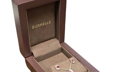 A suite of 9ct white gold ruby and diamond set...