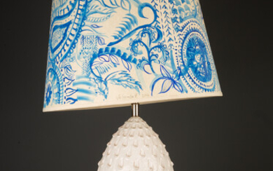 A white glazed pottery table lamp