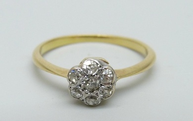A yellow metal and diamond daisy cluster ring, 2.3g, P