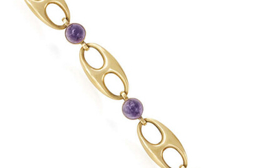 AN AMETHYST AND GOLD BRACELET, CIRCA 1950 The...