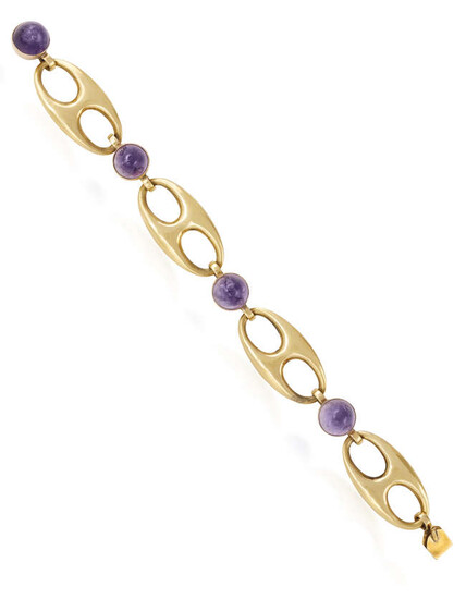 AN AMETHYST AND GOLD BRACELET, CIRCA 1950 The...