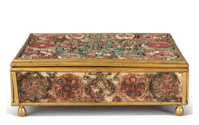 AN ENGLISH PAPER SCROLLWORK LIDDED BOX, THE SCROLLWORK PANELS LATE 17TH/EARLY 18TH CENTURY, THE GILTWOOD CASE OF LATER DATE