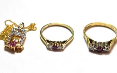 An 18 carat gold ruby and diamond three stone ring,...