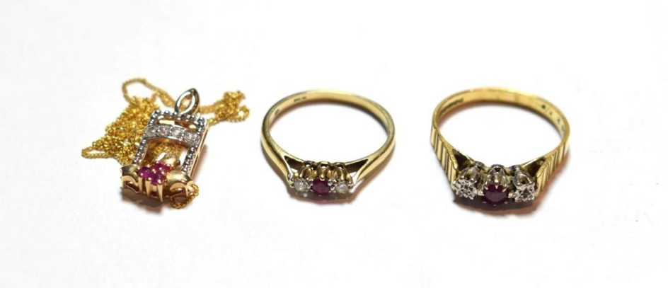 An 18 carat gold ruby and diamond three stone ring,...