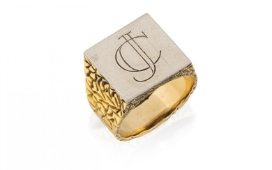 An 18ct gold bi-colour signet ring, by Garrard & Co, the square white gold bezel engraved with the initials JC to broad tapering textured hoop, maker's mark for Garrard & Co, London import hallmarks, 1977, ring size Q