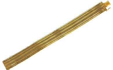 An 18ct gold flexible bracelet, of chevron linking, London import hallmarks for 1963, stamped Italy, length 18.5 cm, approximate gross weight 44g