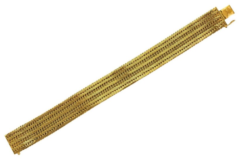 An 18ct gold flexible bracelet, of chevron linking, London import hallmarks for 1963, stamped Italy, length 18.5 cm, approximate gross weight 44g