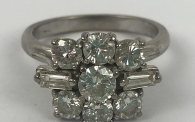 An 18ct white gold and diamond cluster ring, set with two ba...