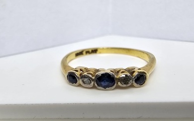 An 18ct yellow gold 5 stone ring inset with 3 blue sapphire ...