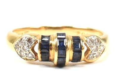 An 18ct yellow gold sapphire and diamond ring. The ring havi...