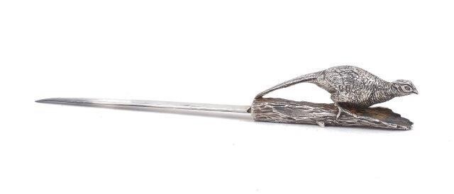 An Asprey & Co. letter opener with pheasant handle, the blade hallmarked Birmingham, 1995, the cast handle (unmarked) designed as a pheasant on a branch, 21.2cm long