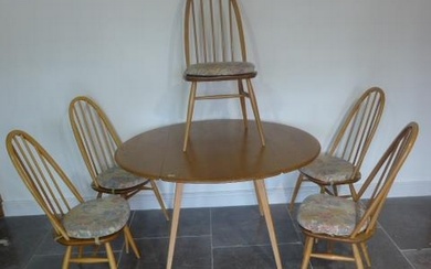 An Ercol Golden Dawn elm drop leaf dining table with 5 stick...