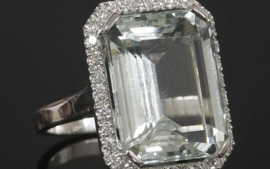An Italian white gold aquamarine and diamond halo cluster ring