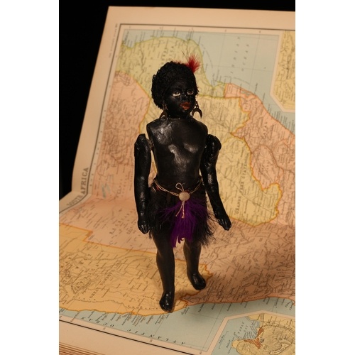 An early 20th century black composition jointed doll, painte...