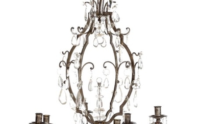 An early 20th century cage shaped Baroque style chandelier with silver painted metal frame, eight branches. H. 85. Diam. 60 cm.