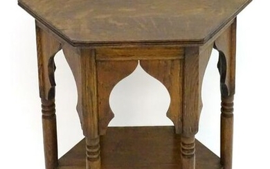 An early 20thC Liberty style oak Moorish table with a