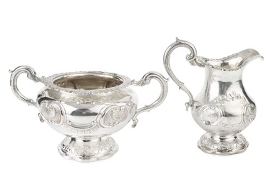 An early Victorian silver twin handled sucrier, and matching milk...