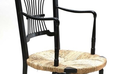 An ebonised 'Sussex' armchair