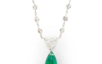 An emerald, diamond and fourteen karat white gold