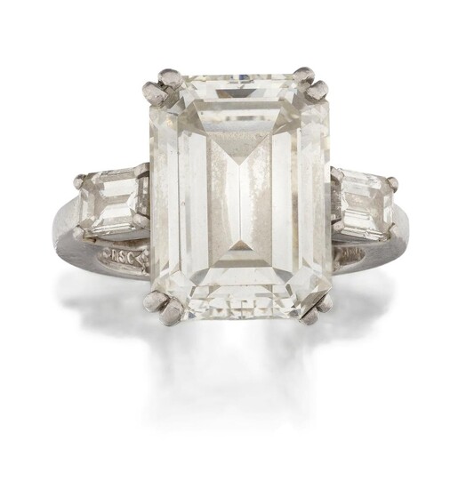 An important diamond single stone ring, the rectangular-cut diamond weighing 10.35 carats, to baguette diamond single stone shoulders, in platinum mount, approx. ring size F Accompanied by report number 000922B/RVR, dated 26th September 2000, from...