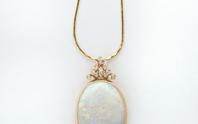 An opal, diamond and fourteen karat gold pendant