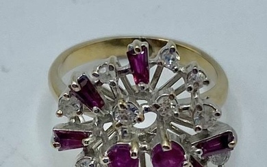 An unmarked yellow and white metal ruby and diamond...
