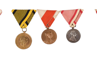 Austria: a small collection of cased medals: i) a set of three medals cased together by Moritz