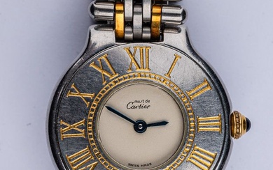 CARTIER Must de Cartier Vers 2000. Montre bracelet de dame en acier et métal doré....