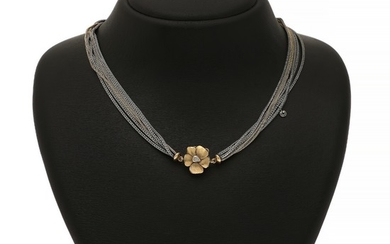 Charlotte Lynggaard: A 14k gold flower clasp set with two brilliant-cut diamonds, with matching six-strand sterling silver and 14k gold necklace.