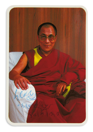 DALAI LAMA; 14TH. Small color Photograph Signed and dated, half-length portrait showing him...