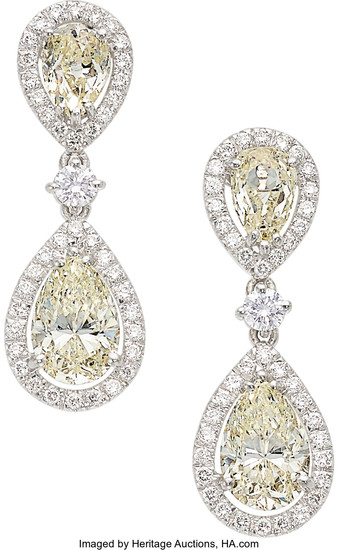 Diamond, White Gold Earrings The earrings feature pear-shaped diamonds...