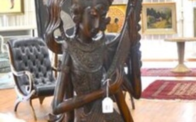 Far Eastern statue in exotic carved wood: "Divinity...